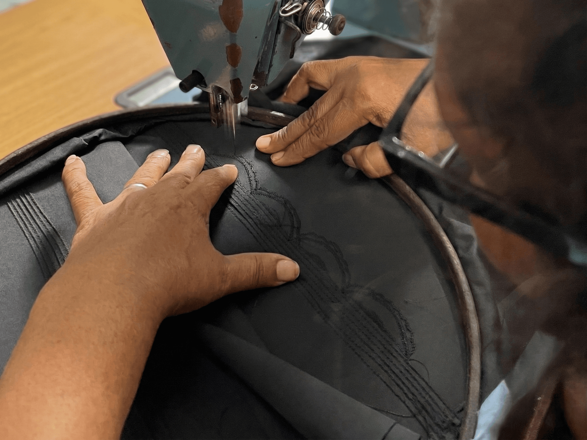 Hands sewing close up